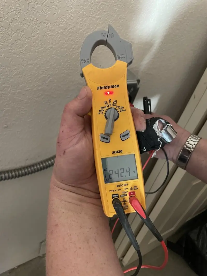 Voltage testing with clamp meter during Electrical Installation Services in Dunn